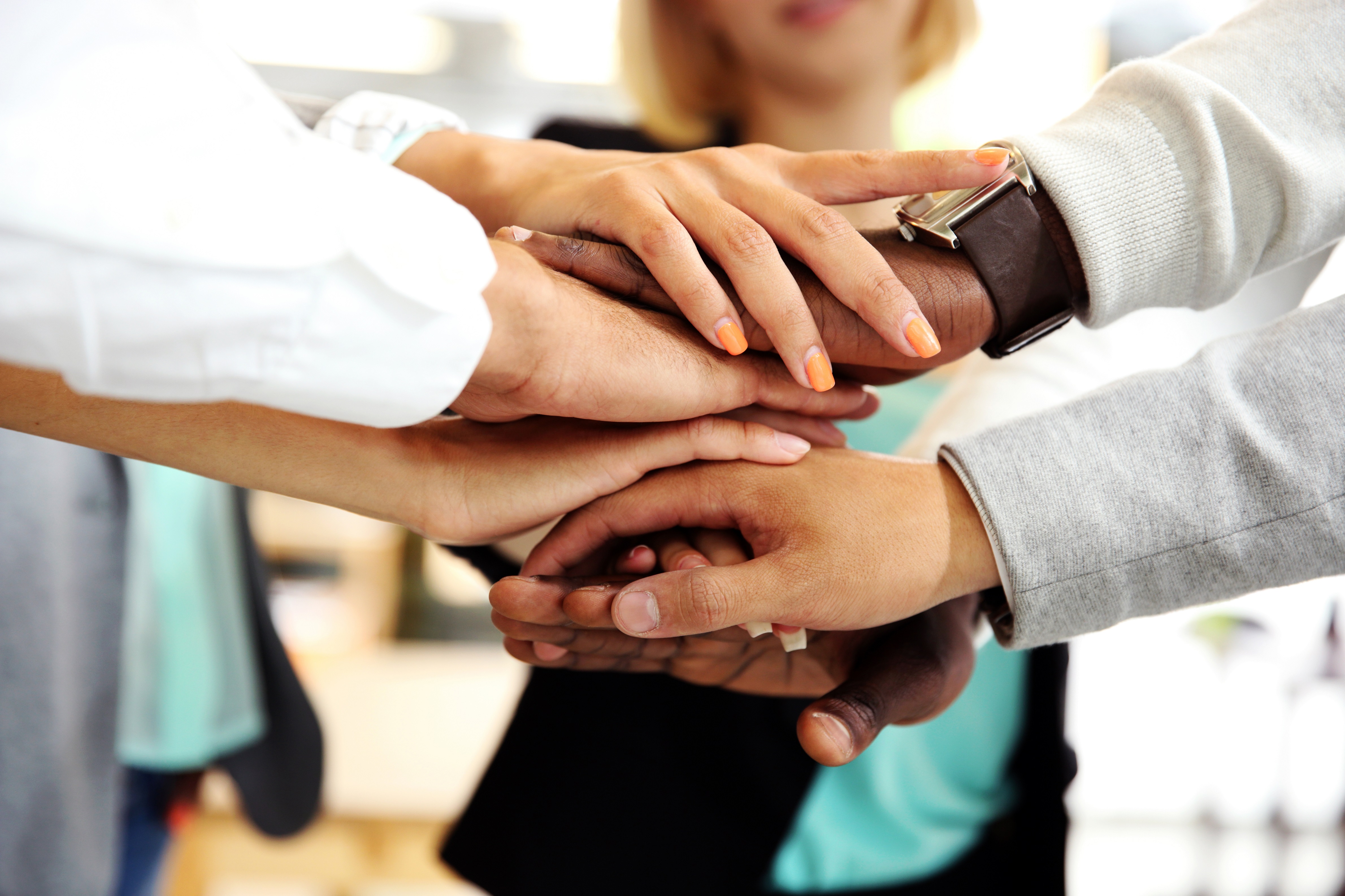 Business people joining hands Business people joining hands